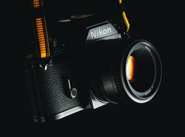 Nikon camera with a black body and lens, highlighted against a dark background, representing photography themes relevant to Brett A. Franks' content on Elite Aeola Labs.
