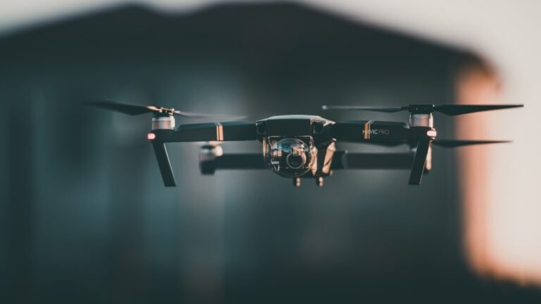 Drone hovering in the air, showcasing advanced photography capabilities, against a blurred background, relevant to articles on photography and technology.